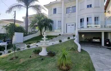 Imagem: A casa em condomínio possui 4 Dormitórios, 5 Banheiros, 4