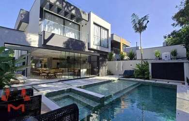 Imagem: A casa possui 5 Dormitórios, 5 Banheiros, 4 Vagas na garagem