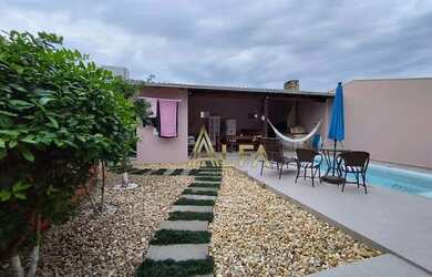 Imagem: A casa possui 3 Dormitórios, 3 Banheiros, 3 Vagas na garagem