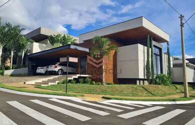 Imagem: A casa possui 4 Dormitórios, 5 Banheiros, 4 Vagas na garagem