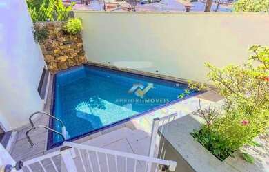 Imagem: A casa possui 3 Dormitórios, 5 Banheiros, 5 Vagas na garagem