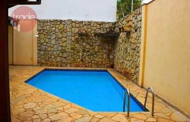 Imagem: A casa possui 4 Dormitórios, 5 Banheiros, 5 Vagas na garagem