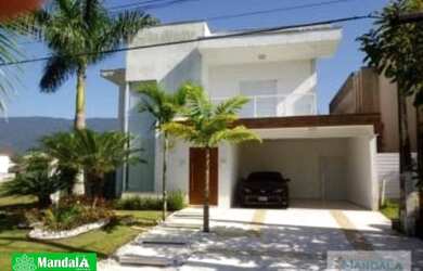 Imagem: A casa possui 4 Dormitórios, 5 Banheiros, 4 Vagas na garagem