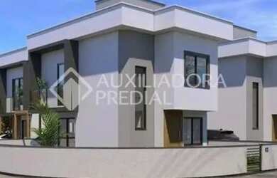 Imagem: A casa possui 2 Dormitórios, 3 Banheiros, 1 Vaga na garagem