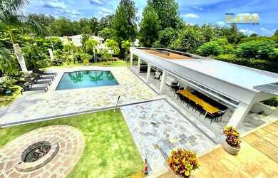 Imagem: A casa em condomínio possui 5 Dormitórios, 5 Banheiros, 5