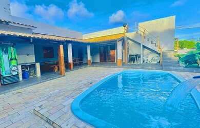 Imagem: A casa possui 3 Dormitórios, 5 Banheiros, 5 Vagas na garagem