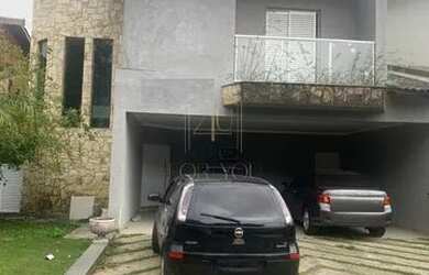 Imagem: A casa possui 4 Dormitórios, 5 Banheiros, 4 Vagas na garagem