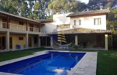 Imagem: A casa possui 5 Dormitórios, 5 Banheiros, 5 Vagas na garagem