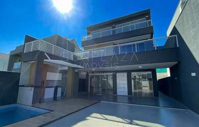 Imagem: A casa possui 4 Dormitórios, 5 Banheiros, 2 Vagas na garagem