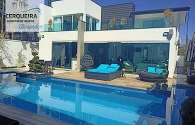 Imagem: A casa possui 5 Dormitórios, 5 Banheiros, 4 Vagas na garagem