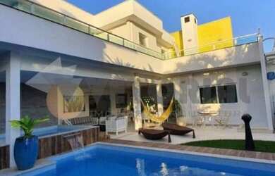 Imagem: A casa em condomínio possui 4 Dormitórios, 4 Banheiros, 5