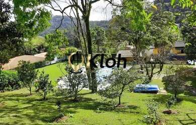 Imagem: A casa possui 4 Dormitórios, 5 Banheiros, 5 Vagas na garagem