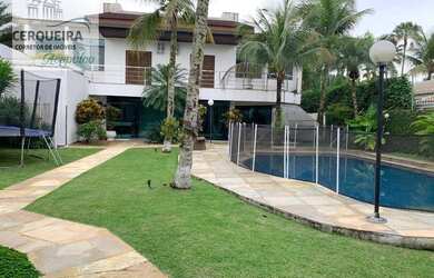 Imagem: A casa possui 5 Dormitórios, 5 Banheiros, 4 Vagas na garagem