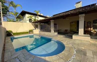 Imagem: A casa possui 4 Dormitórios, 4 Banheiros, 4 Vagas na garagem