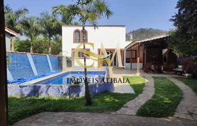 Imagem: A casa possui 2 Dormitórios, 3 Banheiros, 4 Vagas na garagem