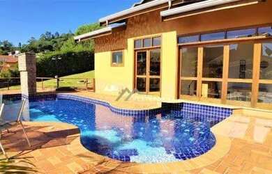 Imagem: A casa em condomínio à venda possui 4 Dormitórios, 5 Banheiros