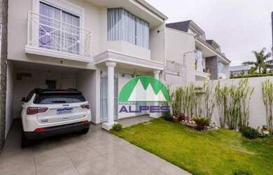 Imagem: A casa possui 3 Dormitórios, 3 Banheiros, 3 Vagas na garagem