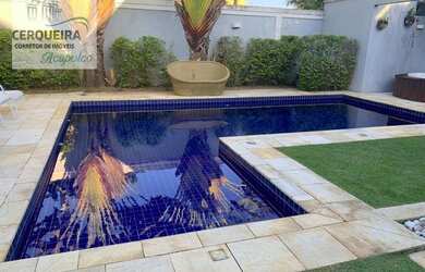 Imagem: A casa possui 4 Dormitórios, 5 Banheiros, 4 Vagas na garagem