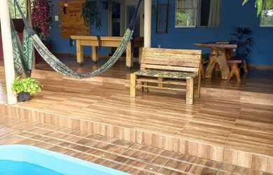 Imagem: A casa possui 3 Dormitórios, 4 Banheiros, 5 Vagas na garagem