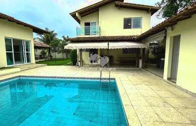 Imagem: A casa possui 5 Dormitórios, 4 Banheiros, 4 Vagas na garagem