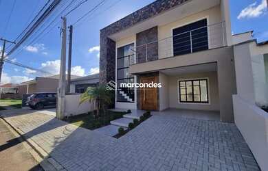 Imagem: A casa possui 3 Dormitórios, 3 Banheiros, 2 Vagas na garagem