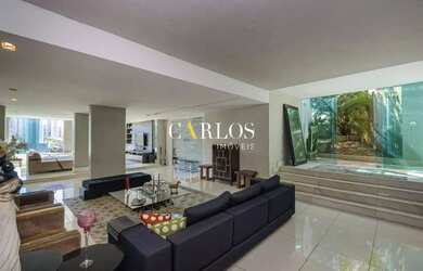 Imagem: A casa possui 5 Dormitórios, 5 Banheiros, 4 Vagas na garagem