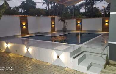 Imagem: A casa possui 4 Dormitórios, 4 Banheiros, 4 Vagas na garagem