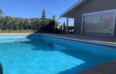 Imagem: A casa possui 5 Dormitórios, 5 Banheiros, 5 Vagas na garagem