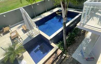 Imagem: A casa possui 3 Dormitórios, 4 Banheiros, 4 Vagas na garagem