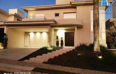 Imagem: A casa possui 3 Dormitórios, 5 Banheiros, 4 Vagas na garagem