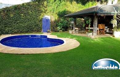 Imagem: A casa em condomínio à venda possui 4 Dormitórios, 5 Banheiros