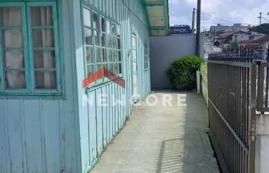 Imagem: A casa possui 2 Dormitórios, 1 Banheiro, 2 Vagas na garagem