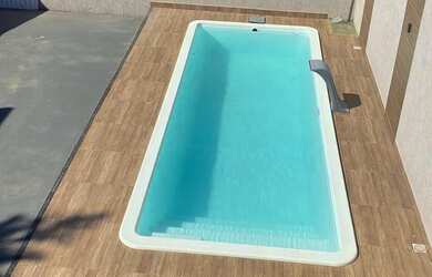 Imagem: A casa possui 3 Dormitórios, 3 Banheiros, 5 Vagas na garagem