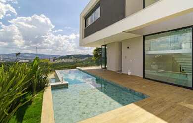 Imagem: A casa em condomínio possui 4 Dormitórios, 5 Banheiros, 5