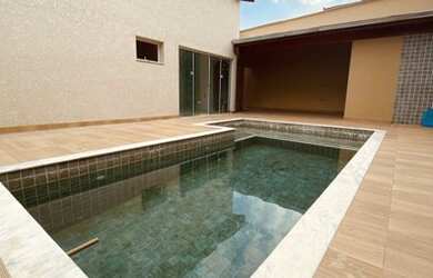 Imagem: A casa possui 3 Dormitórios, 4 Banheiros, 5 Vagas na garagem