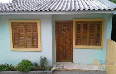 Imagem: A casa possui 2 Dormitórios, 1 Banheiro, 1 Vaga na garagem