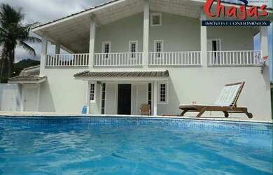 Imagem: A casa possui 5 Dormitórios, 5 Banheiros, 5 Vagas na garagem