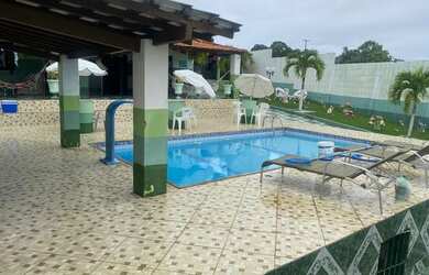 Imagem: A casa possui 4 Dormitórios, 5 Vagas na garagem e está localizado