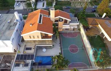 Imagem: A casa possui 5 Dormitórios, 5 Banheiros, 5 Vagas na garagem