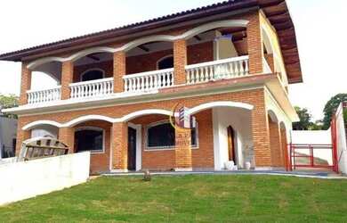 Imagem: A casa possui 5 Dormitórios, 5 Banheiros, 5 Vagas na garagem