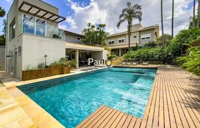 Imagem: A casa em condomínio possui 4 Dormitórios, 5 Banheiros, 4