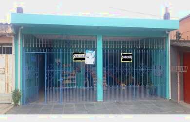 Imagem: A casa possui 3 Dormitórios, 2 Banheiros, 4 Vagas na garagem