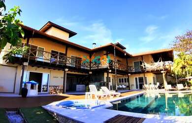 Imagem: A casa possui 5 Dormitórios, 5 Banheiros, 5 Vagas na garagem