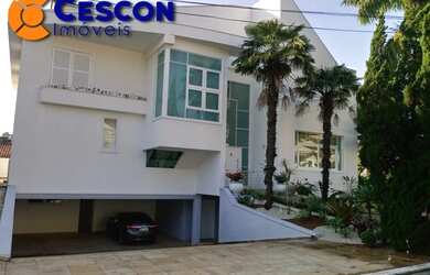 Imagem: A casa em condomínio possui 4 Dormitórios, 4 Banheiros, 5