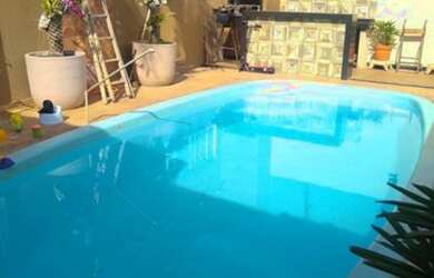 Imagem: A casa possui 5 Dormitórios, 3 Banheiros, 4 Vagas na garagem