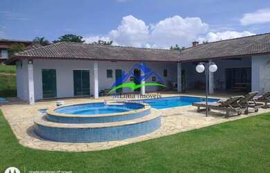 Imagem: A casa em condomínio possui 4 Dormitórios, 5 Banheiros, 4