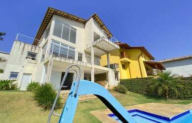 Imagem: A casa possui 3 Dormitórios, 5 Banheiros, 5 Vagas na garagem