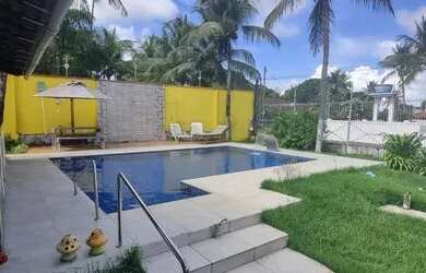 Imagem: A casa possui 4 Dormitórios, 4 Banheiros, 5 Vagas na garagem