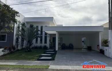 Imagem: A casa possui 3 Dormitórios, 5 Banheiros, 4 Vagas na garagem