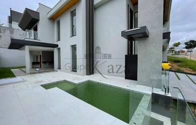 Imagem: A casa em condomínio possui 4 Dormitórios, 5 Banheiros, 5